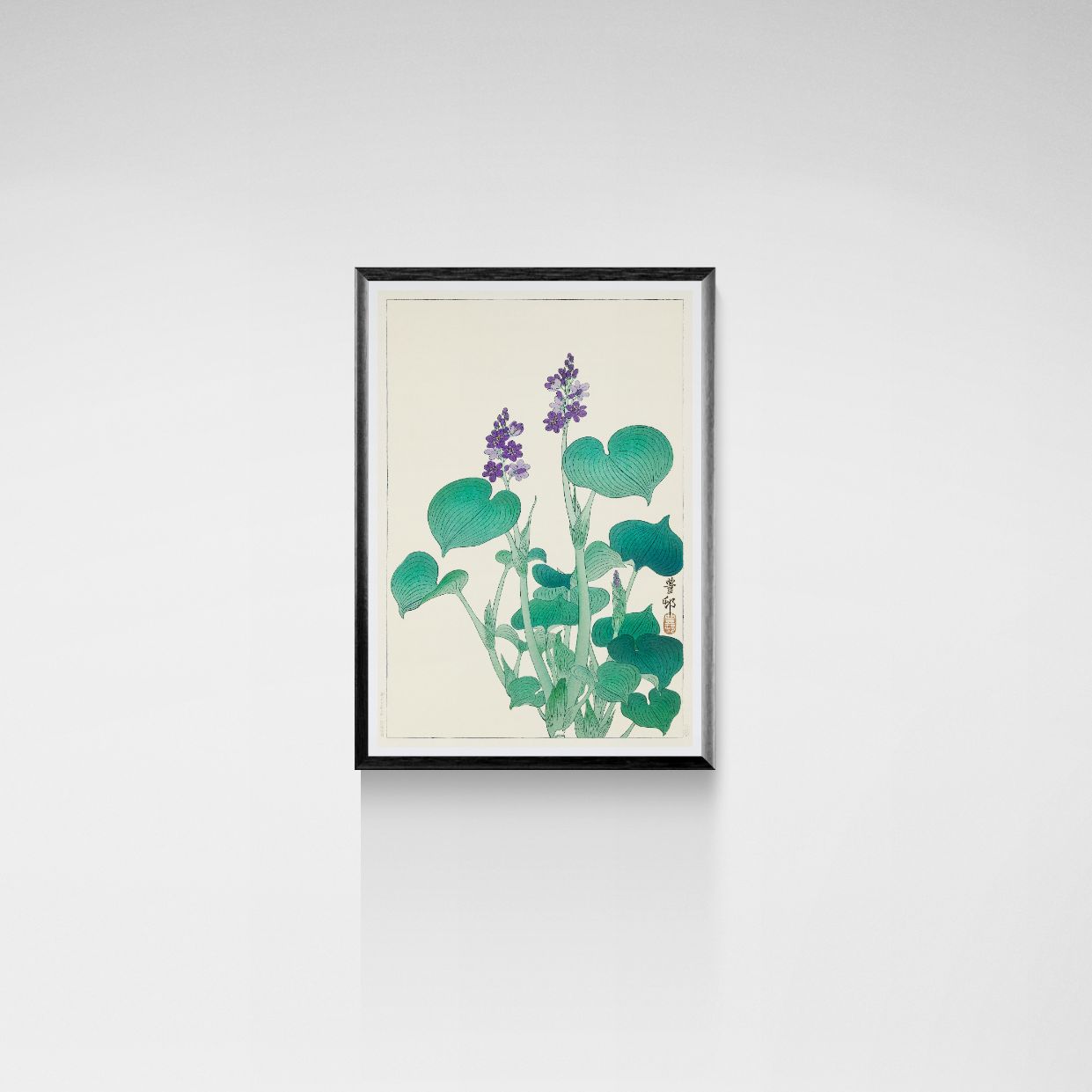 Framed artwork of green leaves and purple flowers on a beige background