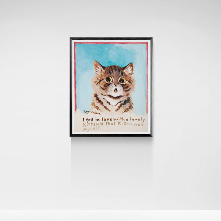 Framed artwork of a cat with text on a white wall