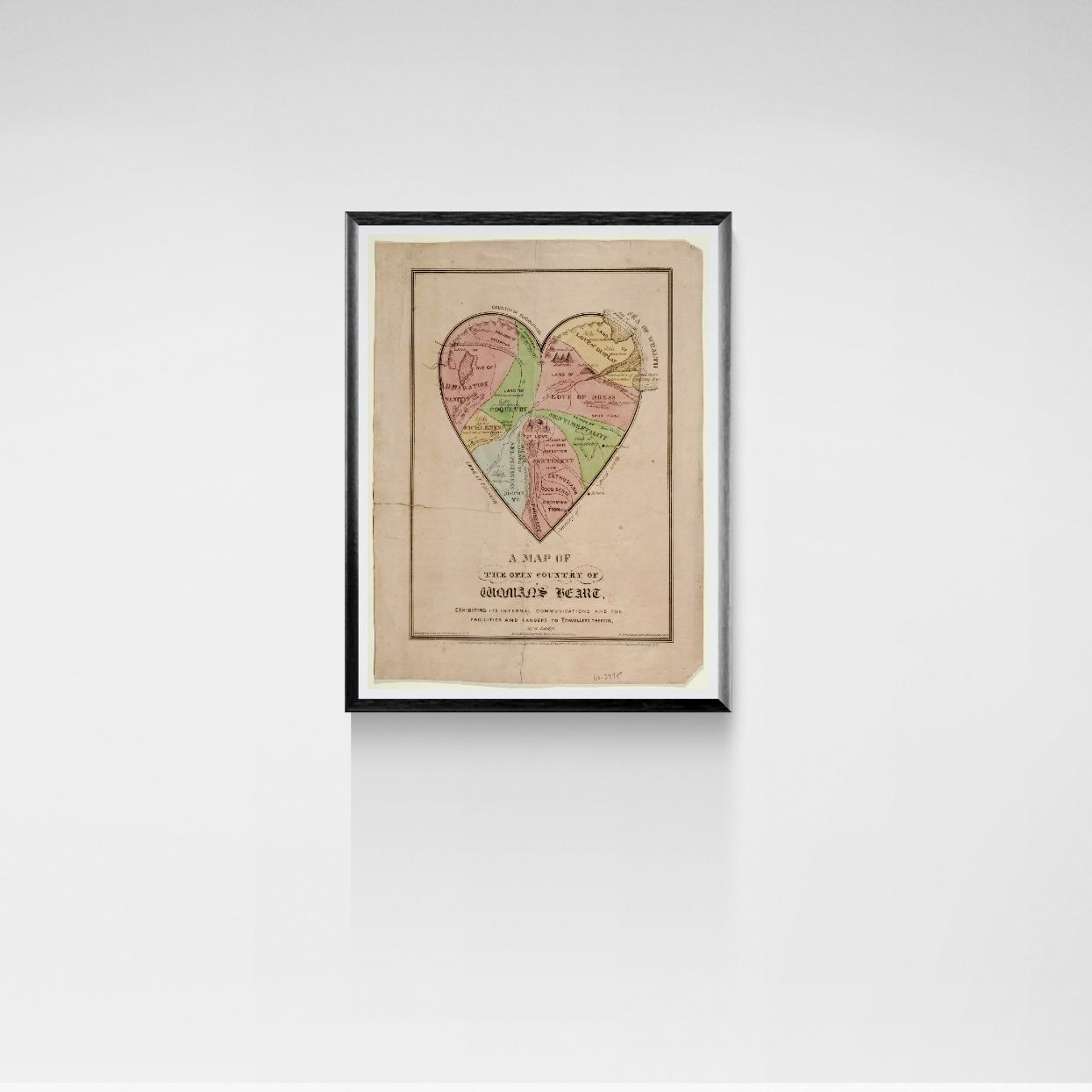 Framed map of a heart-shaped area on a white wall