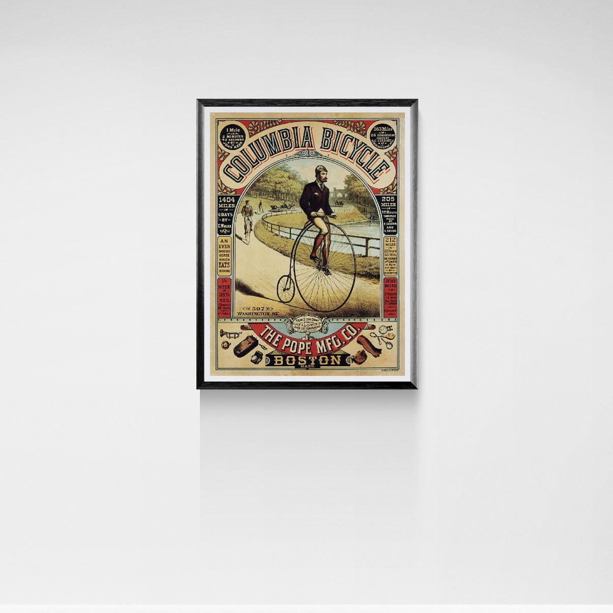 Framed vintage-style advertisement poster for Columbia Bicycle on a white wall