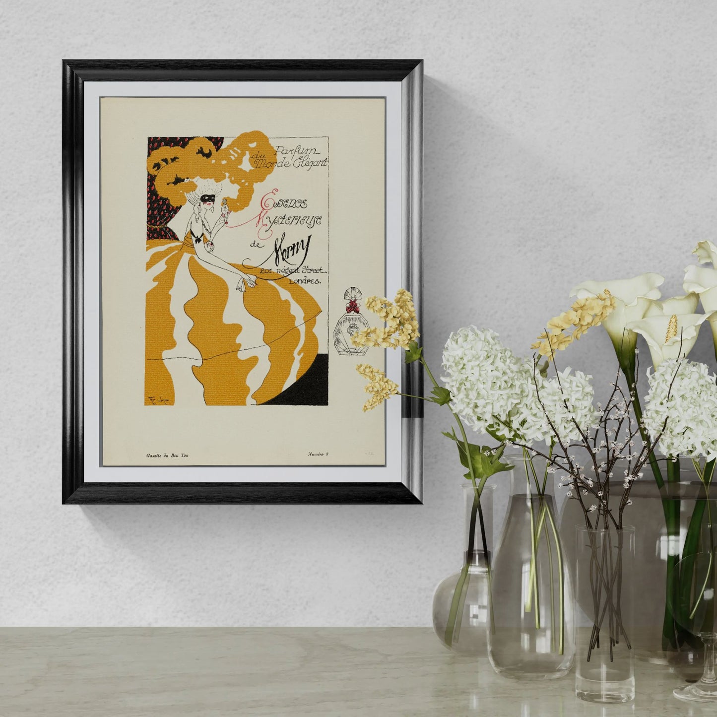 Framed vintage-style poster of a woman in an orange dress on a wall with decorative vases and flowers.