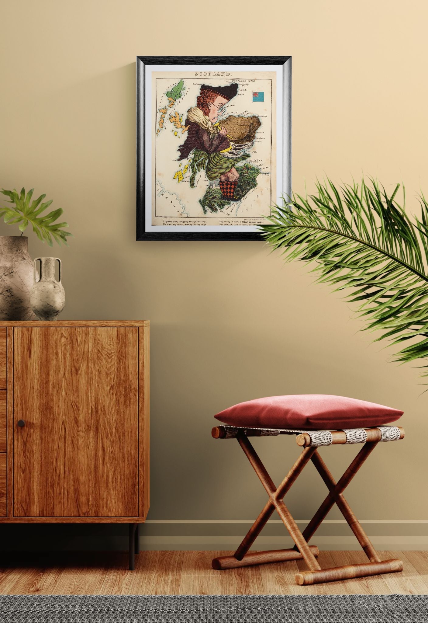 Framed map on a wall with a wooden cabinet and red cushioned stool below.