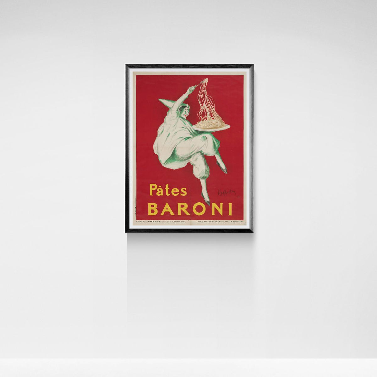 Framed vintage advertisement poster for Pâtes Baroni on a white wall.