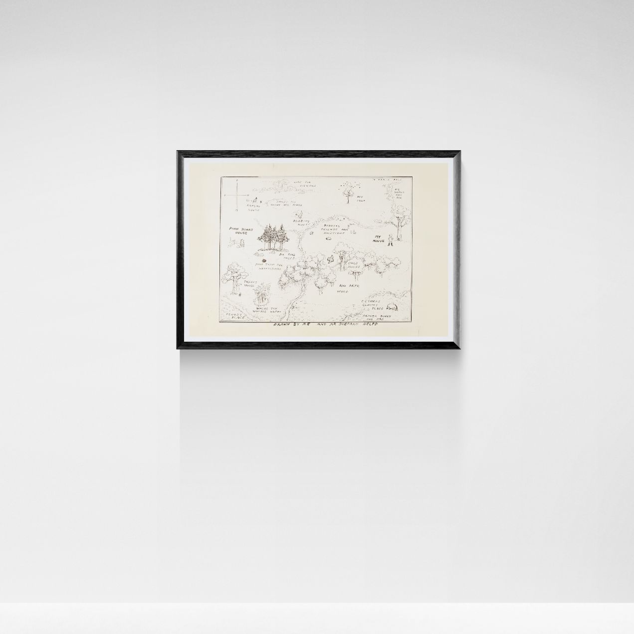 Framed hundred acre wood map on a white wall