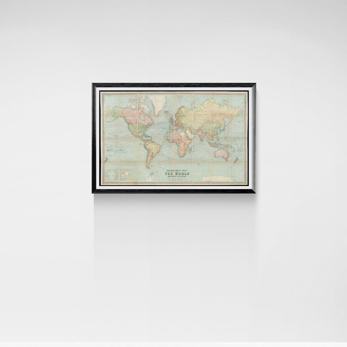 Framed vintage world map on a white wall