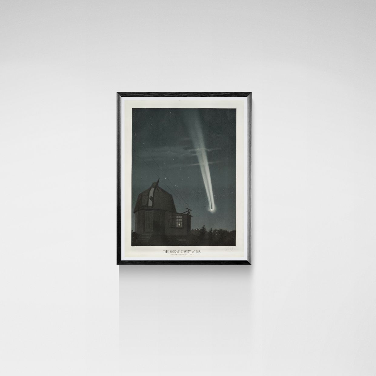 Framed artwork of a celestial scene with a comet over a building on a white wall.