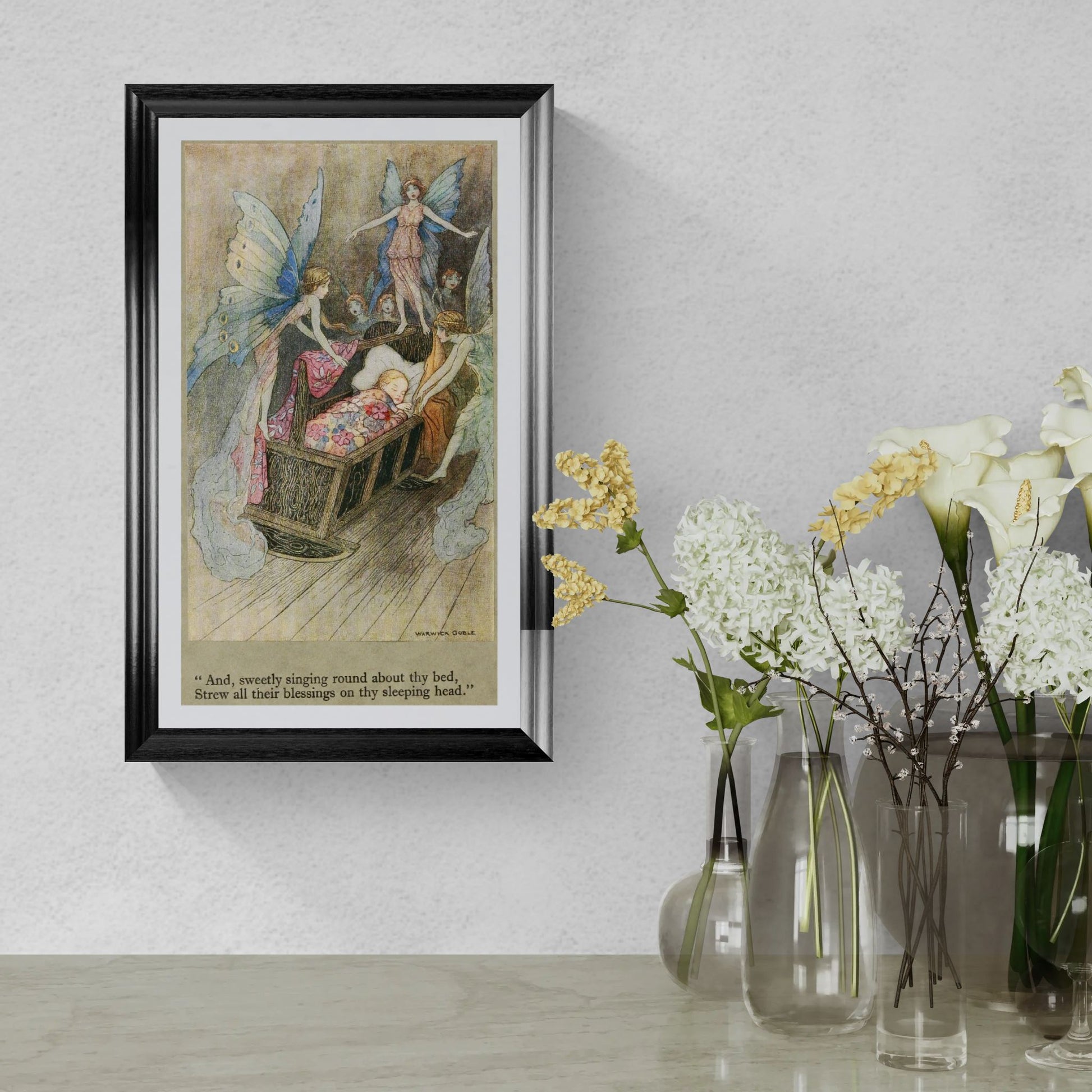 Framed fairy tale illustration on a wall with vases of flowers below.