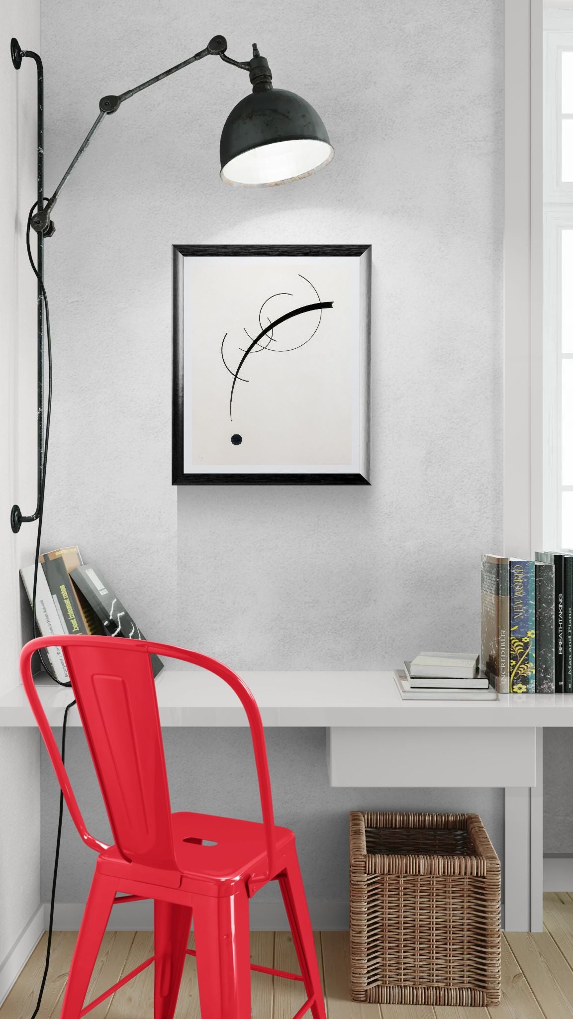 Modern interior with a red chair, white desk, and wall art.