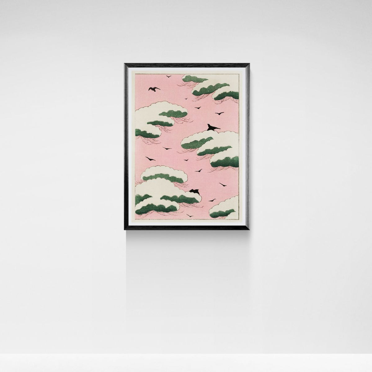 Framed artwork with a pink background and green and white pattern, mounted on a white wall.