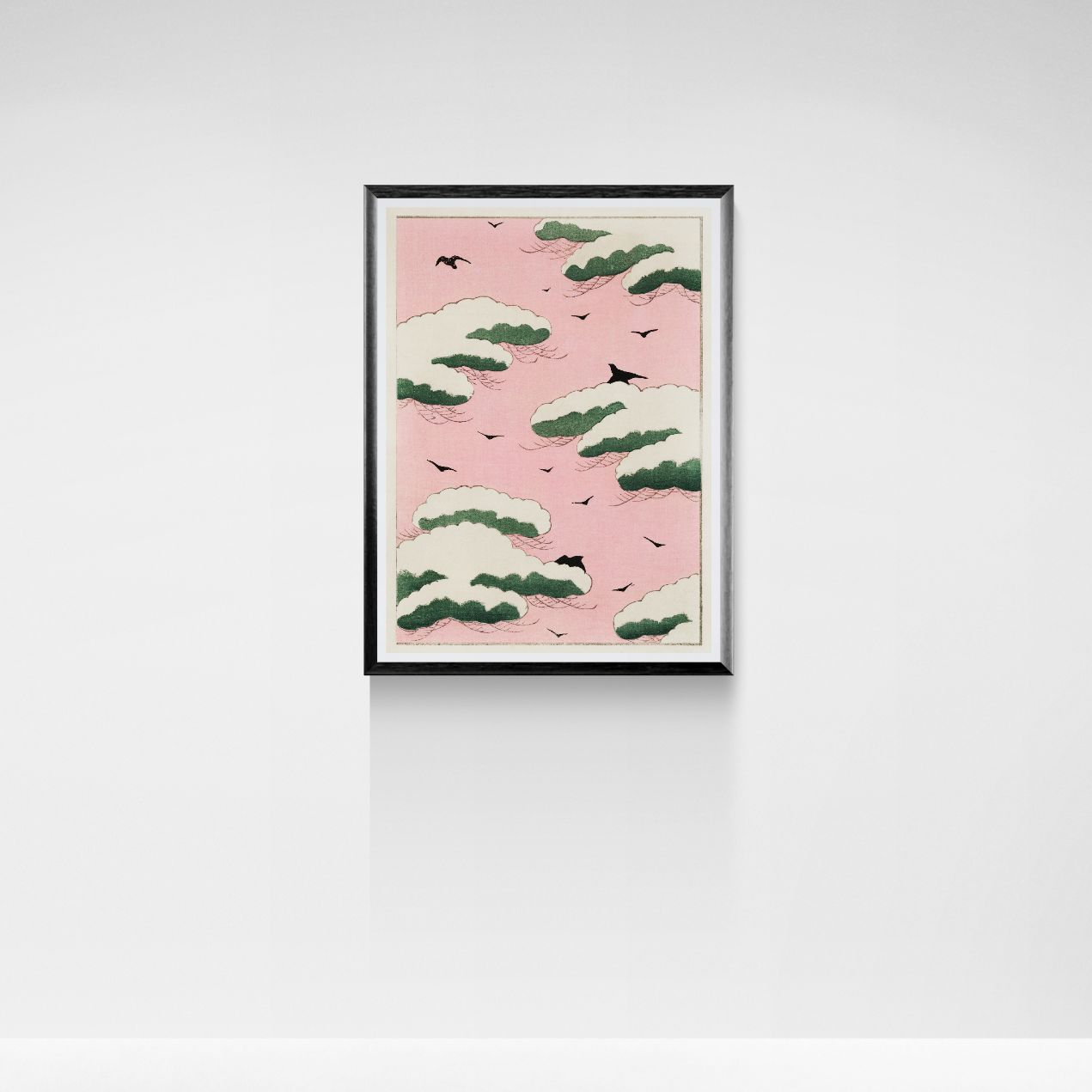 Framed artwork with a pink background and green and white pattern, mounted on a white wall.