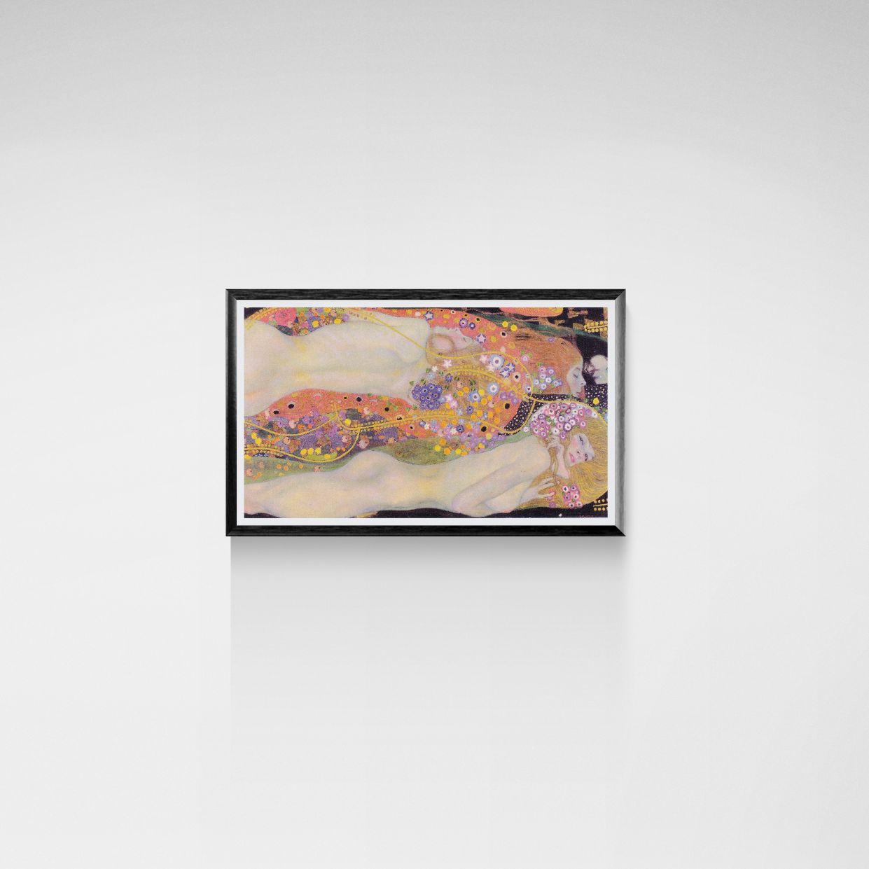 Framed Gustav Klimt artwork on a white wall