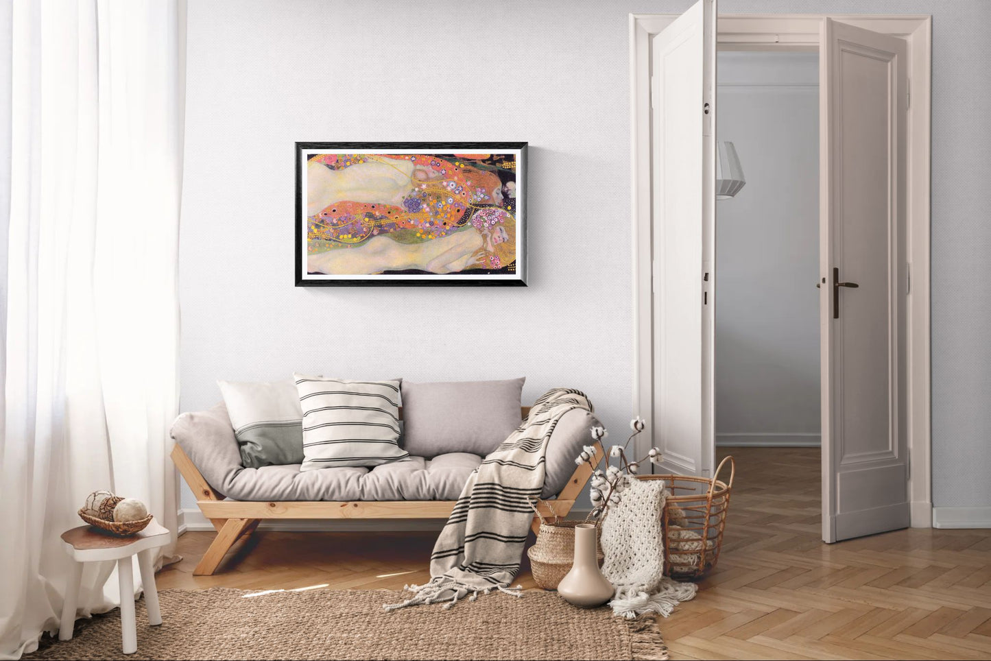 Living room with a sofa, decorative pillows, and a colorful painting on the wall.