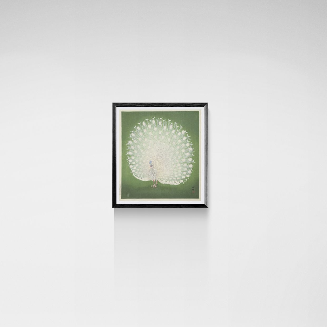Framed artwork of a peacock on a green background