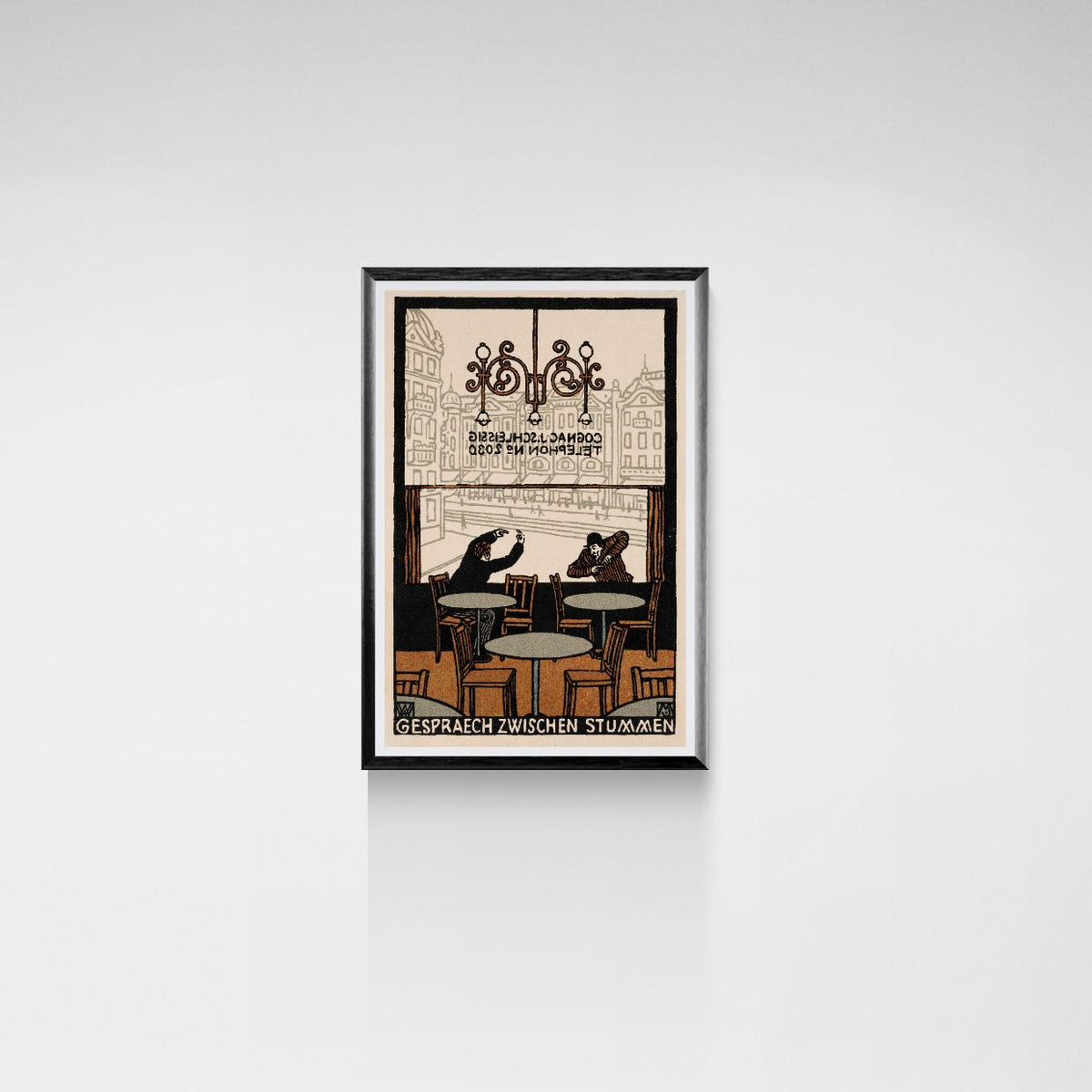 Framed artwork of a vintage-style illustration on a white wall