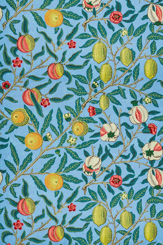 A repeating botanical pattern featuring green leaves, yellow and red citrus fruits, and white flowers on a light blue background.