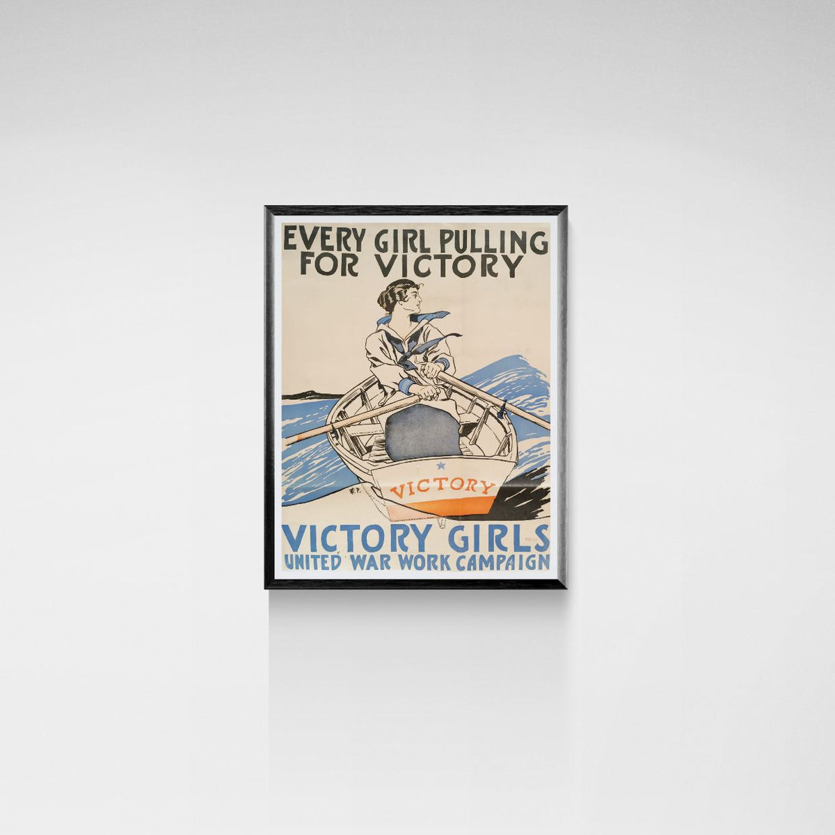 Framed vintage poster with 'Every Girl Pulling for Victory' text and graphic on a white wall.